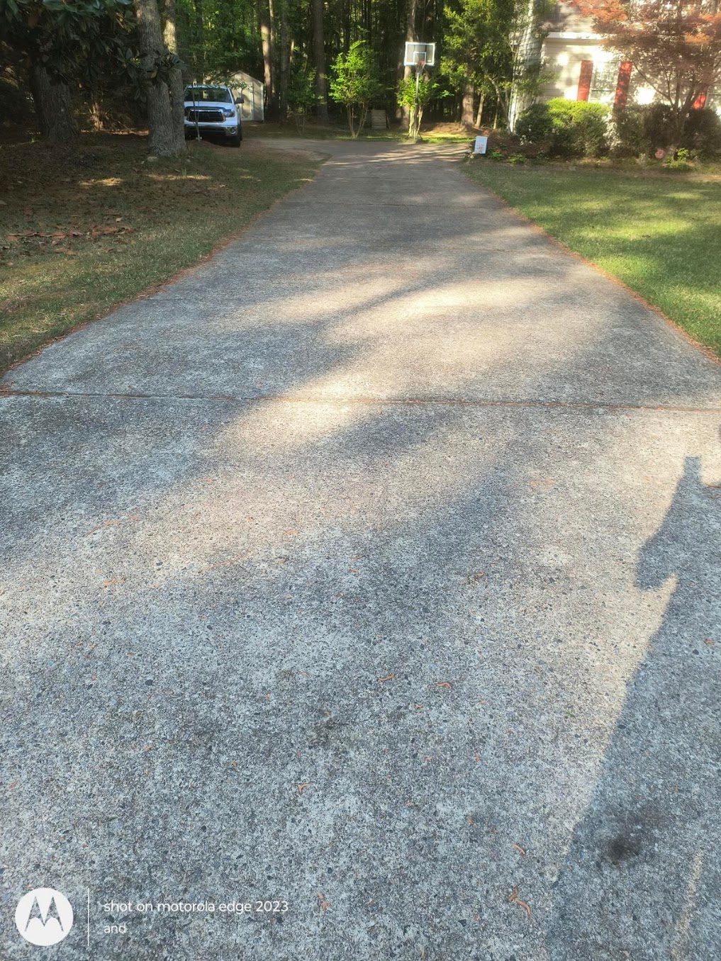 Driveway before pressure washing